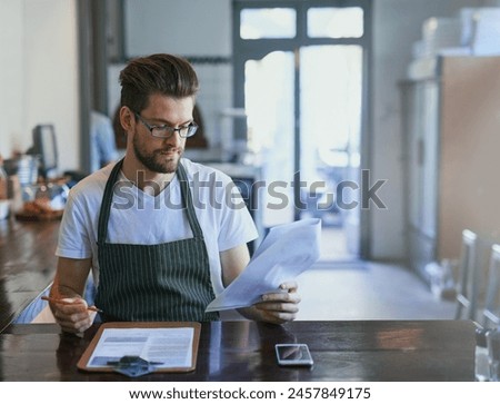 Barista, working and coffee shop with paperwork, order and stocktake or writing, cafe and male manager. Small business, entrepreneur and checklist or review, inventory and clipboard for price list