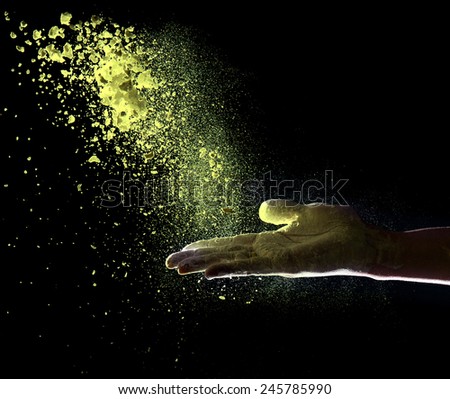 Hand and powder, isolated on black background