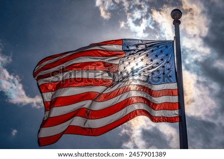 US Flag. Waving american flag on dark dramatic sky. American election and vote concept.