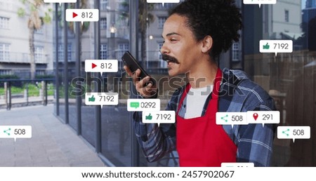 Image of multiple notification bars over biracial man talking on speaker of cellphone. Digital composite, multiple exposure, business, growth, social media reminder and technology concept.