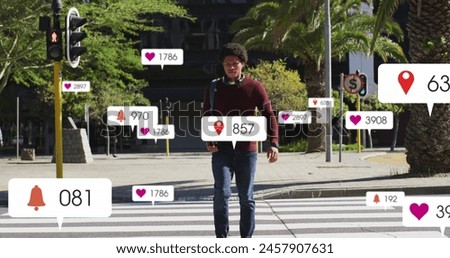 Image of notification bars over biracial man looking at cellphone while crossing street. Digital composite, multiple exposure, business, social media reminder and technology concept. Royalty-Free Stock Photo #2457907631