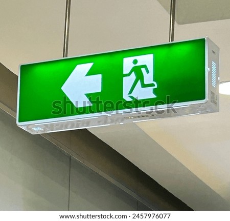 Directional sign. Direction sign to the restroom. fire escape sign