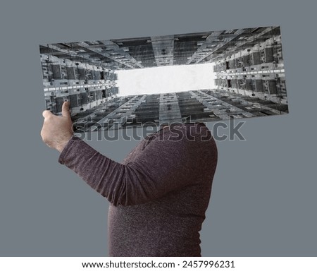 unrecognizable man holding behind head picture with high rise tall building in the form of frame. male bayer seller rentner holding image frame on shoulder. isolated on white grey background.