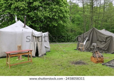 Reenactment of a occupied forces in Denmark during WWII showing the German army military encampment at a living history museum in Denmark Royalty-Free Stock Photo #2458058311