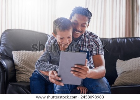Father, tablet and child in home for online streaming, games and happy for cartoon in living room. Man, boy and technology in apartment for movie, video call and reading ebook with love for family