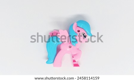 A pink Little Pony toy photographed in close-up