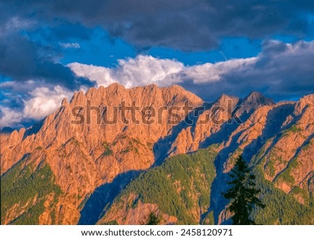 View on Lienzer Dolomiten mountains in the Osttirol region on a summer late afternoon,mountains, jagged rocks, sky, clouds.  Alps, Austria.  Royalty-Free Stock Photo #2458120971