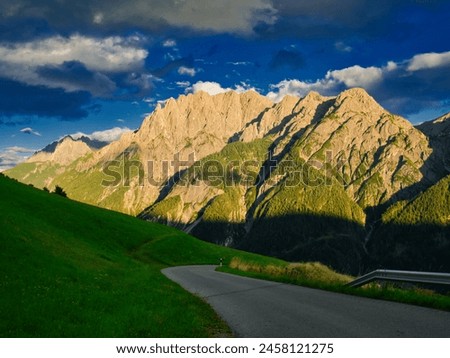 View on Lienzer Dolomiten mountains in the Osttirol region on a summer late afternoon,mountains, jagged rocks, sky, clouds.  Alps, Austria.  Royalty-Free Stock Photo #2458121275