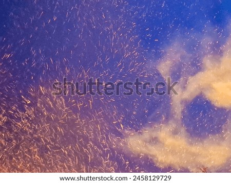 Fire embers particles over black background. Fire sparks background. Czech