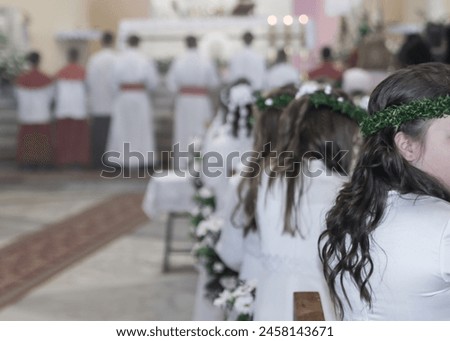 First Holy Communion celebration into a Christian church Royalty-Free Stock Photo #2458143671