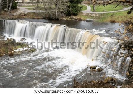 Keila waterfall in autumn. The effect of milk water.