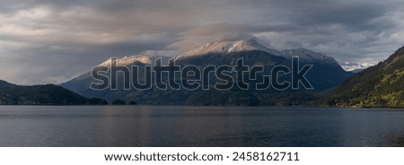 Harrison Lake located in the Fraser Valley of British Columbia with a dusting of snow in the higher elevations. This is a mountain in the Lillooet Ranges of southwestern British Columbia, Canada Royalty-Free Stock Photo #2458162711