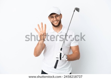 Handsome young man playing golf  isolated on white background happy and counting four with fingers