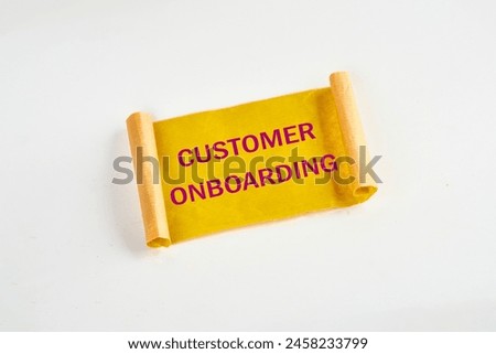 Concept Business. CUSTOMER ONBOARDING symbol on yellow torn paper