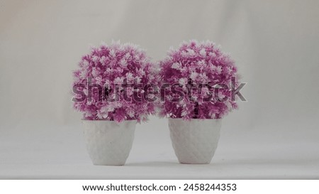 Close up picture of plastic pot and plastic flower. Plastic pot photography . Stock photography.