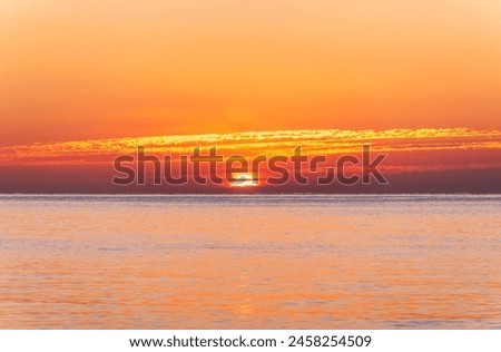 Beautiful red and orange sunrise over the sea. Beautiful seascape scenery, Amazing light of nature sunset background