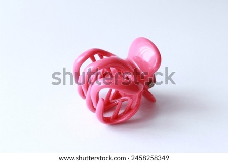 Pink hair clip for women isolated on white background. Pink claw hair clip.