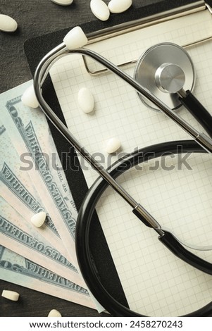 Money with medical equipment, concept of corruption in medicine.