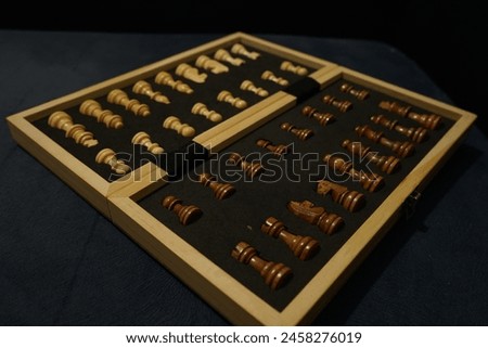 A chessboard with all its pieces set up and ready to be played.