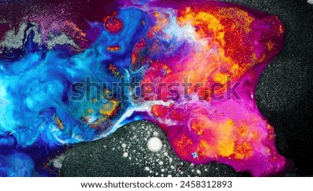 The painting depicts a vibrant, swirling galaxy with a mix of blue, red, and yellow hues. The background features a dark, star-filled sky, and the foreground showcases a cluster of glowing orbs. Royalty-Free Stock Photo #2458312893
