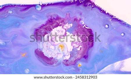The painting depicts a vibrant, swirling galaxy with a central star, surrounded by a cosmic background. Royalty-Free Stock Photo #2458312903
