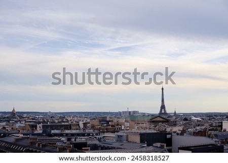 Paris cityscape. Rooftops of the buildings, Eiffel Tower in the background