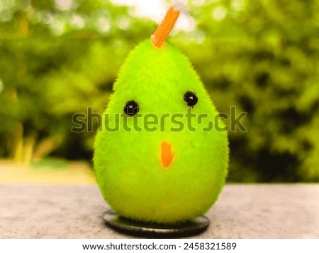 Cute toy hen with beautiful background