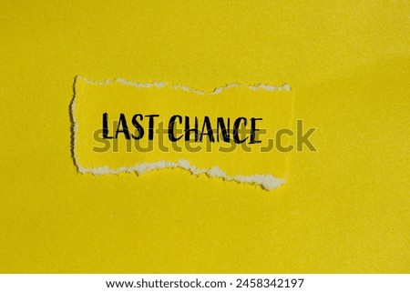 Last chance words written on ripped yellow paper piece with yellow background. Conceptual last chance symbol. Copy space.