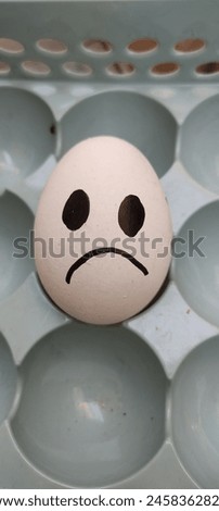 An egg with a sad face emotion