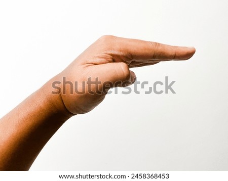 Picture of a human hand gesturing to calm down in a white wall background