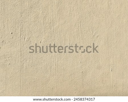 The plain beige cement wall texture