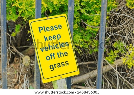 Yellow Please keep vehicles off the grass sign