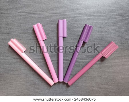 Various shades of purple represented in colorful markers