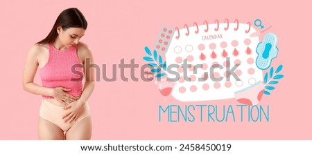 Young woman having cramps and drawn menstrual calendar on pink background