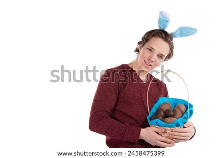 Easter. A young attractive guy in a bunny suit. White background.