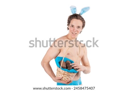 Easter. A young attractive guy in a bunny suit. White background.