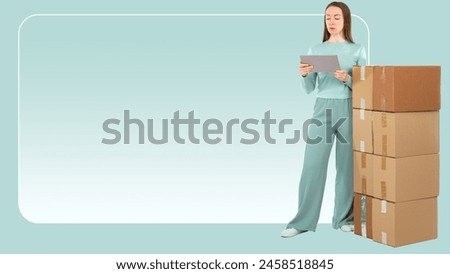 Woman with boxes. Girl doing relocation. Lady with electronic tablet. Moving boxes on turquoise. Copy space. Woman looking for company to help with relocation. Place for advertising moving services Royalty-Free Stock Photo #2458518845