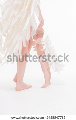 mother and child are angels, Portrait of a beautiful angelic woman with a child