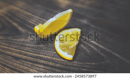 Two lemon slices on a wooden board. 6K POSTER Royalty-Free Stock Photo #2458573897
