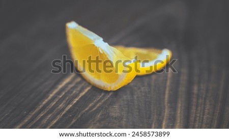 Two lemon slices on a wooden board. 6K POSTER Royalty-Free Stock Photo #2458573899