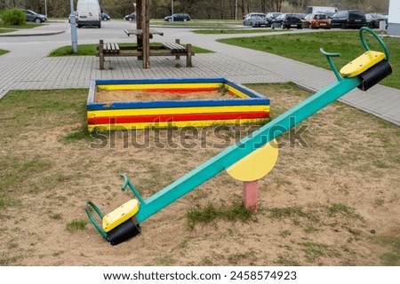 children's playground in a residential area, children's horizontal bars, rock climbing slides