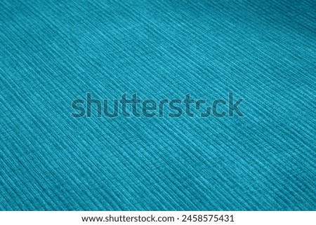 Textured corduroy furniture fabric in blue colors close-up
