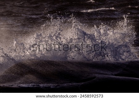 Sunset colors at the horizon, cloudy skies, rainy weather and troubled sea over the Skagerrak ocean. Royalty-Free Stock Photo #2458592573