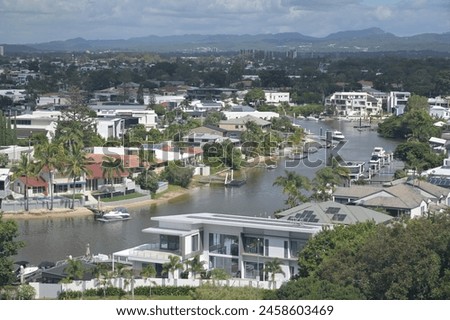 Aerial landscape drone view of Luxury house on Nerang river in Surfers Paradise Gold Coast Queensland, Australia Royalty-Free Stock Photo #2458603469