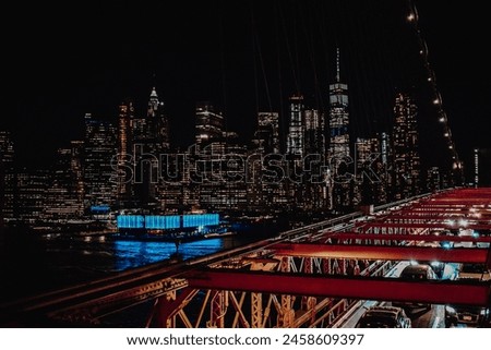 View to Manhattan's city lights from the Brooklyn Bridge.