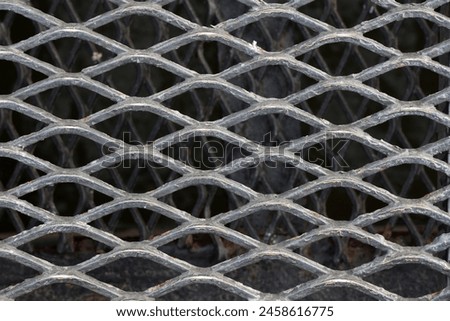 Close-up of a grille of a metal grid. Background