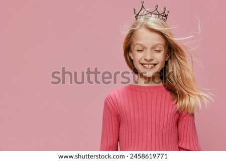 Happy Princess Girl in Pink Dress Celebrating Birthday with a Crown This image captures a joyful and cute little girl dressed in a pink princess gown, wearing a crown, and celebrating her birthday