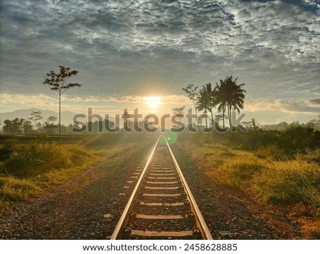 railway tracks there is sunrise in the morning