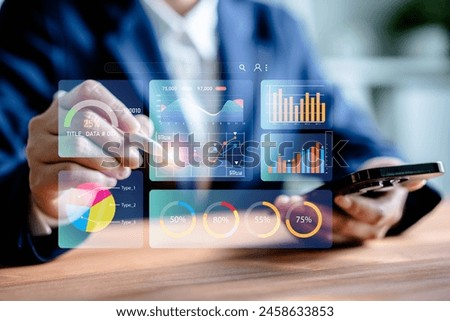 Businesswomen analyze chart data business on a visual screen dashboard laptop, technology devices and screens visible in the background, financial planning, market research, KPI, and the stock market.