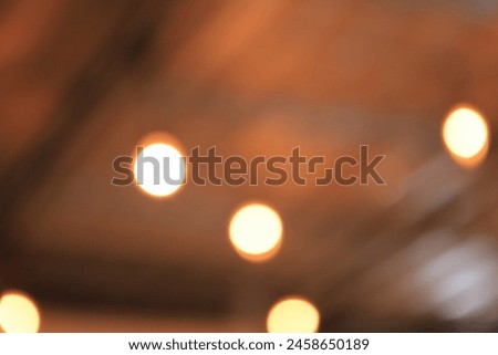 Abstract bokeh background yellow peach colored, natural glare from lights